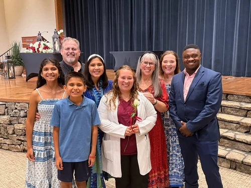 Junior nursing major Ella Jones and her family celebrate her accomplishment at the White Coat Ceremony.